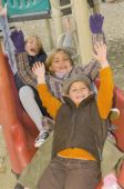 Three Young Children Playing At A Playground Photo (1869148)