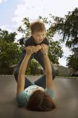 Mother Playing With Son On Trampoline Photo (1806599)