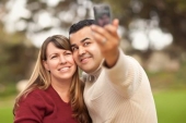 Attractive Mixed Race Couple Taking Self Portraits Photo (4755491)