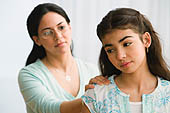 Hispanic mother comforting daughter Photo (BLD049476)